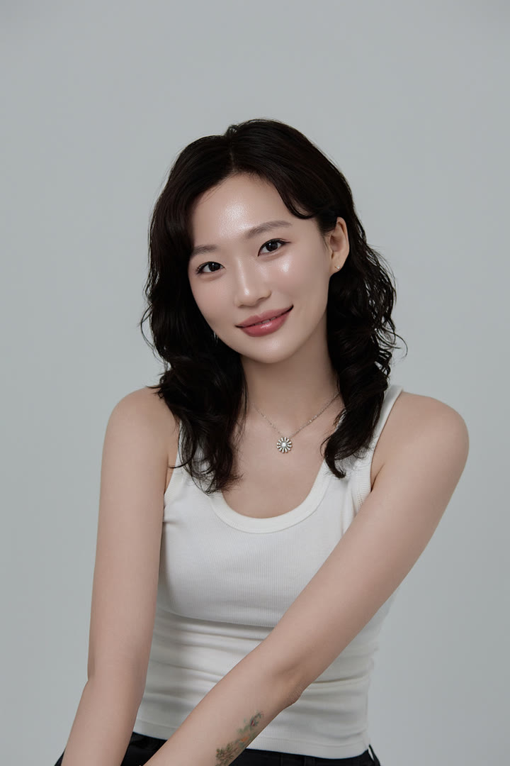 Studio portrait of Summer in a white tank top